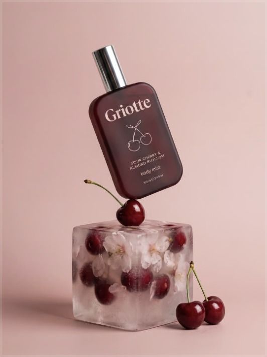 Perfume bottle on a cherry ice cube
