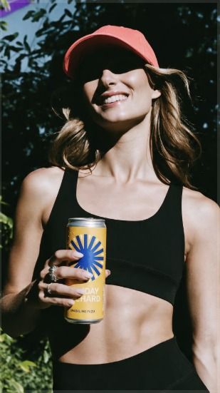 Runner holding a drink can