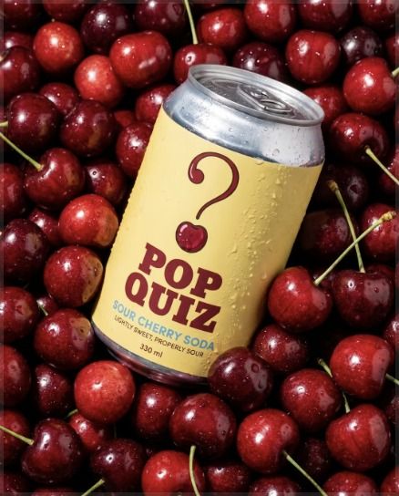 Soda can among cherries