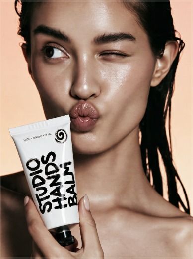 Model with hand balm